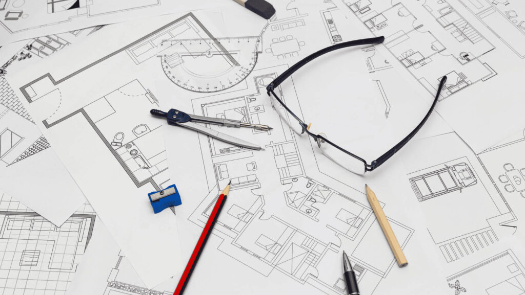 Plan de construction avec lunettes et compas
